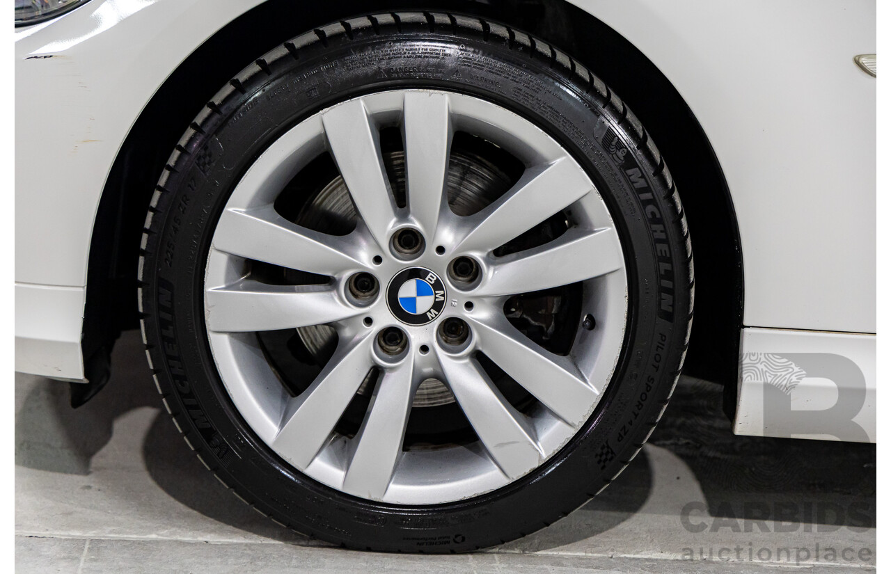 9/2010 BMW 325i Exclusive E90 MY10 4d Sedan Alpine White 2.5L