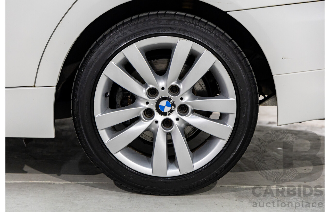 9/2010 BMW 325i Exclusive E90 MY10 4d Sedan Alpine White 2.5L