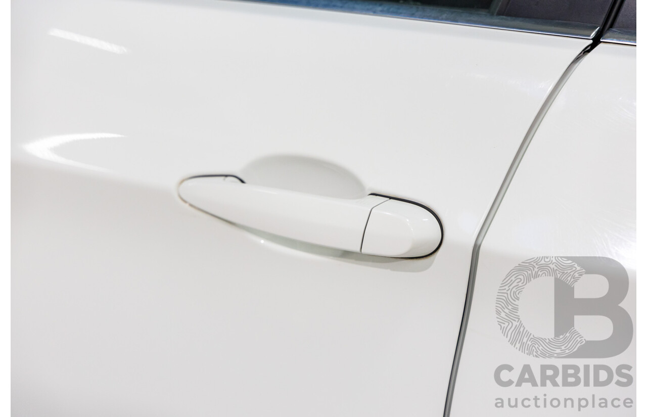 9/2010 BMW 325i Exclusive E90 MY10 4d Sedan Alpine White 2.5L