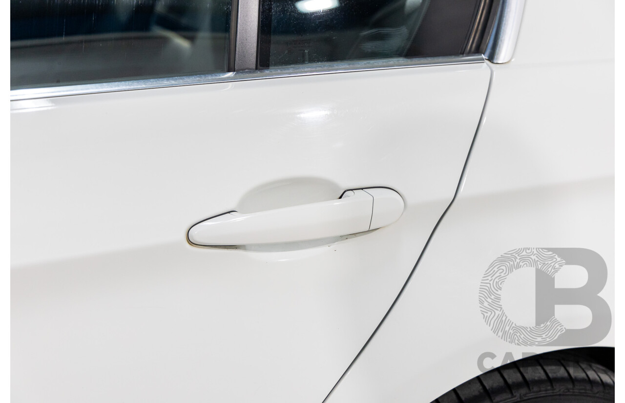 9/2010 BMW 325i Exclusive E90 MY10 4d Sedan Alpine White 2.5L