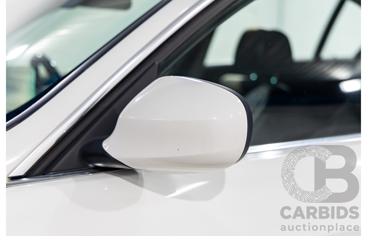 9/2010 BMW 325i Exclusive E90 MY10 4d Sedan Alpine White 2.5L