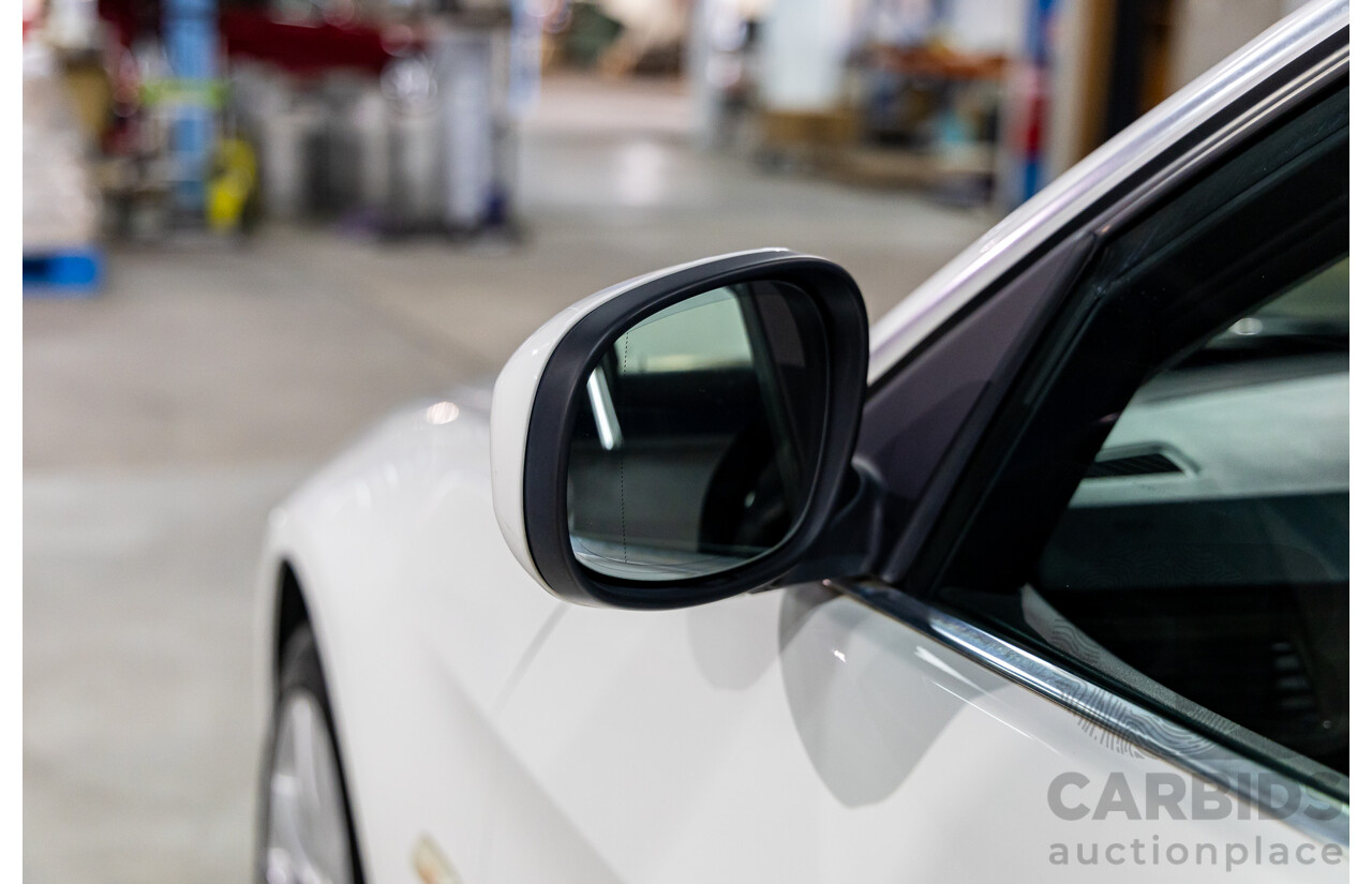 9/2010 BMW 325i Exclusive E90 MY10 4d Sedan Alpine White 2.5L