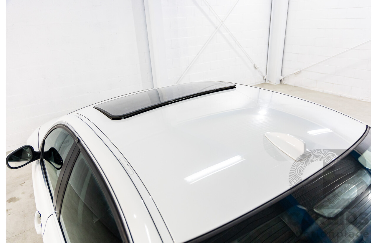 9/2010 BMW 325i Exclusive E90 MY10 4d Sedan Alpine White 2.5L