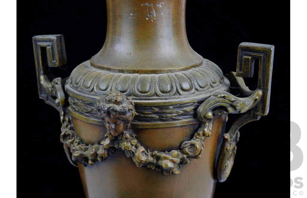 Antique Italian Spelter Chiming Mantle Clock with Neo Classical Theme on Onyx Bases with Two Female Figures and Cherub, After Geo Maxim, Pair Garniture Urns with Floral Garlands, Porcelain Floral Face, Later Movement