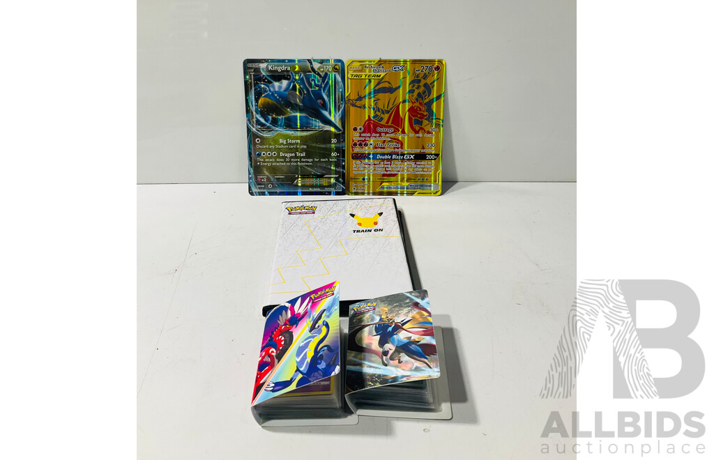 Collection of Oversized and Foil Pokemon TCG Cards Including Pikachu Vmax, Morpeko Vunion, Oversized Reshiram and Charizard Tag Team GX, Oversized Kingdra EX and Much More