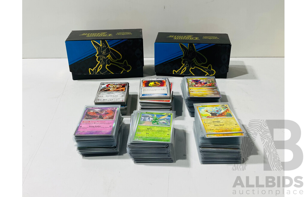 Collection of Pokemon TCG Cards Including Holographic Foil Cards Stored in Two Crown Zenith Bundle Boxes
