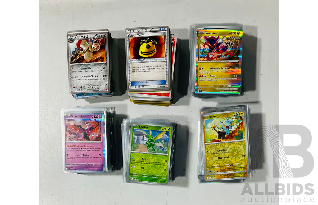 Collection of Pokemon TCG Cards Including Holographic Foil Cards Stored in Two Crown Zenith Bundle Boxes