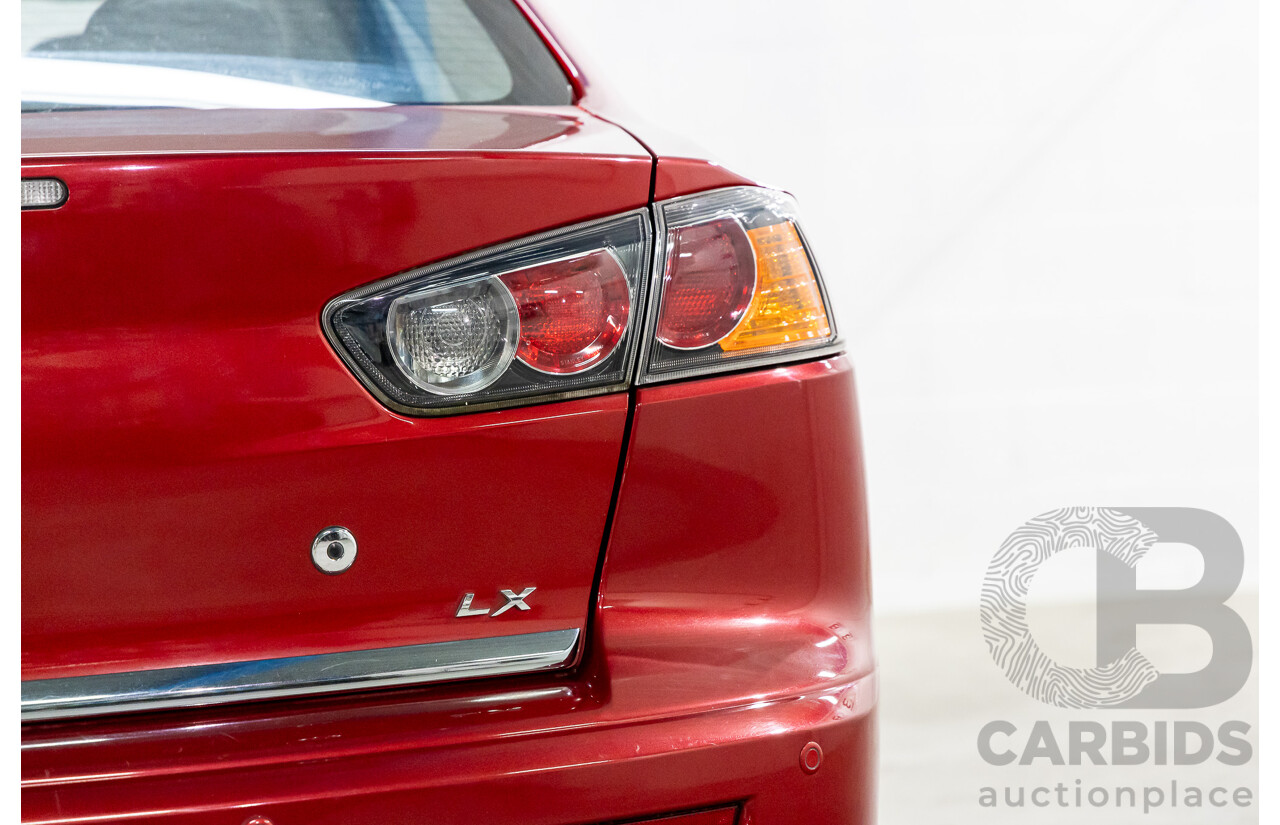 1/2013 Mitsubishi Lancer LX CJ MY13 4d Sedan Red Metallic 2.0L