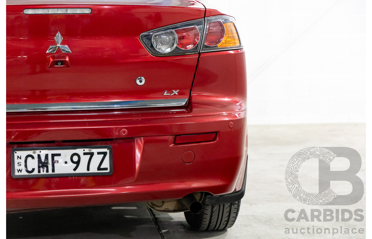 1/2013 Mitsubishi Lancer LX CJ MY13 4d Sedan Red Metallic 2.0L