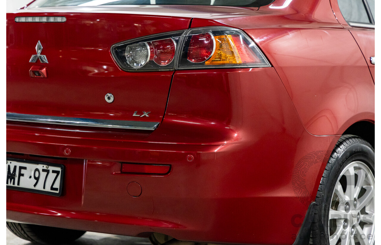 1/2013 Mitsubishi Lancer LX CJ MY13 4d Sedan Red Metallic 2.0L
