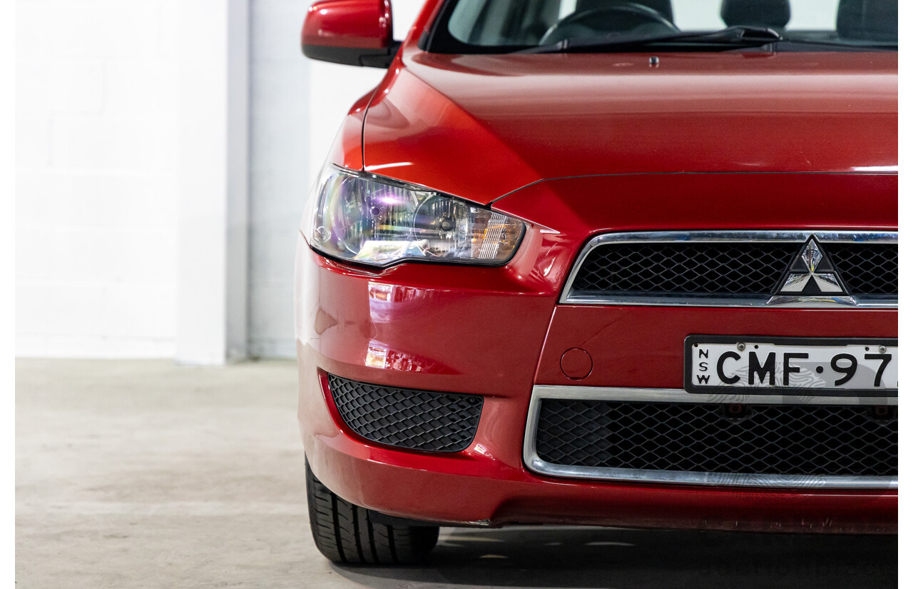 1/2013 Mitsubishi Lancer LX CJ MY13 4d Sedan Red Metallic 2.0L