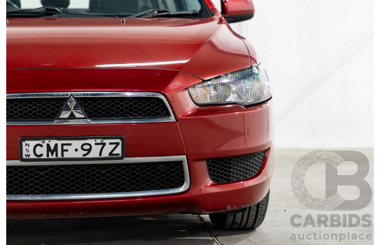 1/2013 Mitsubishi Lancer LX CJ MY13 4d Sedan Red Metallic 2.0L