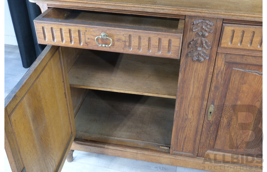 Vintage Oak Sideboard with Carvings, Beveled Glass, Mirrors and Turned Supports