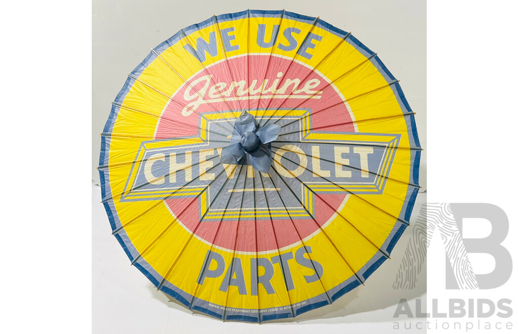 Two Paper Asian Umbrellas 'We Use Genuine Chevrolet Parts'