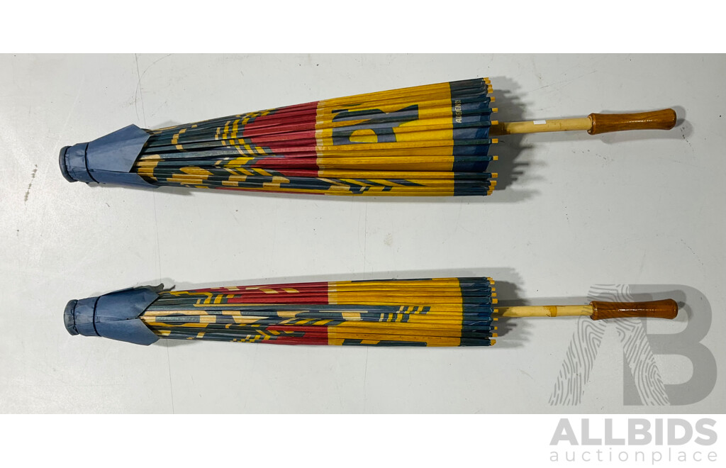 Two Paper Asian Umbrellas 'We Use Genuine Chevrolet Parts'