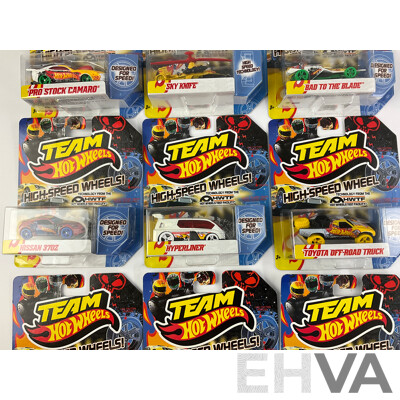 Nine Boxed Hot Wheels High Speed Wheels Including Stock Camaro, Sky Knife, Bad to the Blade, Nissan 370Z, Hyperliner, Toyota Off Road Truck, Hyundai Genesis Coupe, Pontiac