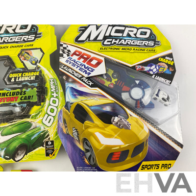 Twelve Boxed Micro Chargers Electronic Quick Charge Cars, Including Three Launcher Packs