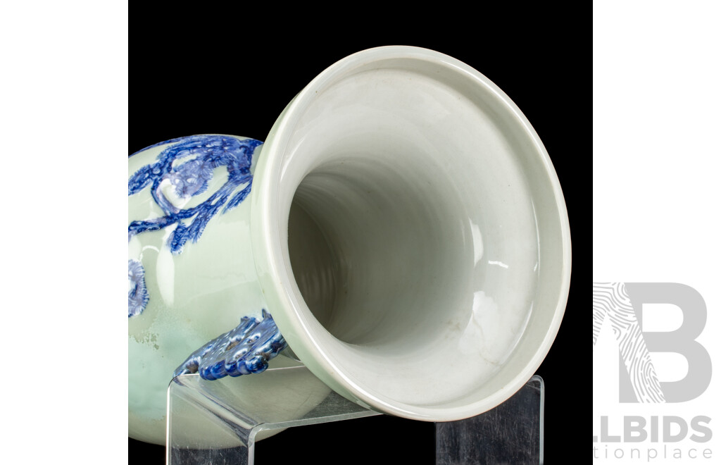 Large Vintage Chinese Porcelain Vase with Twin Lion Dog Form Handles and Body with Raised Blue and White Lion Dog and Eagle Scene with Auspicious Bats to Reverse Side