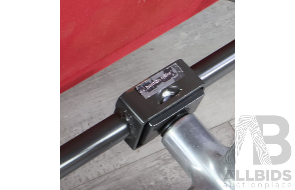 Pair of Herman Millers Eames Soft Pad Swivel Arm Chairs