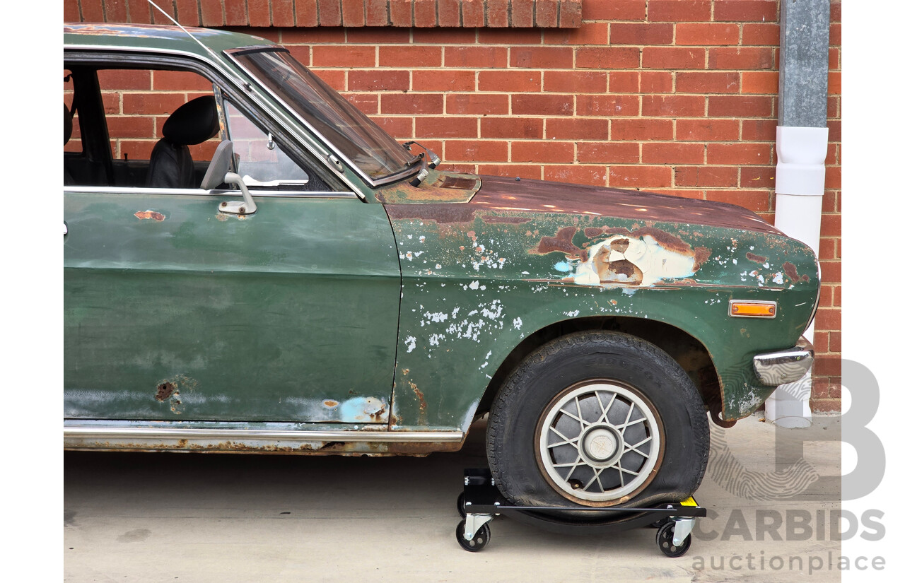 9/1973 Datsun 1200 Deluxe B110 2d Coupe Green 1.2L