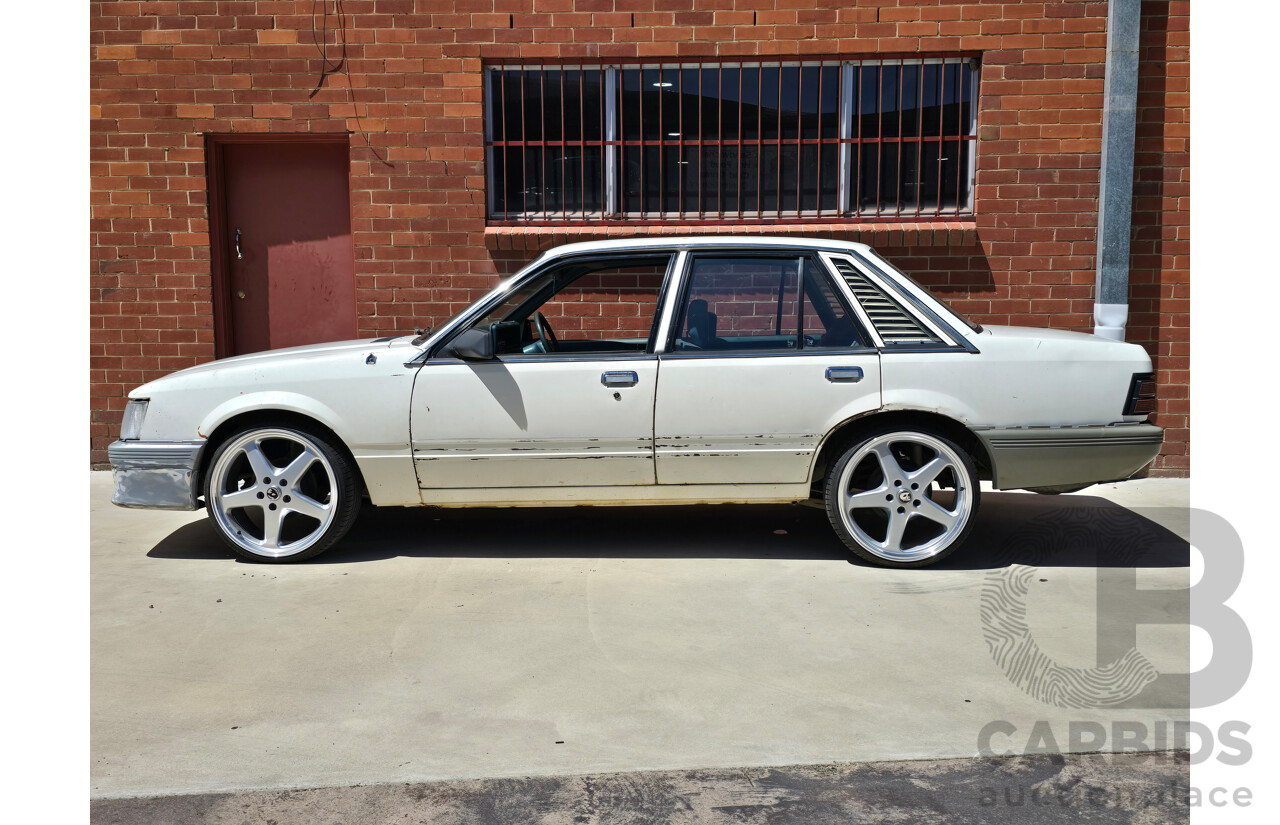 7/1984 Holden VK Commodore SL 4d Sedan Alpine White 3.3L