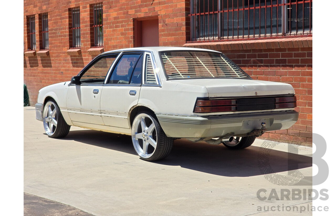 7/1984 Holden VK Commodore SL 4d Sedan Alpine White 3.3L