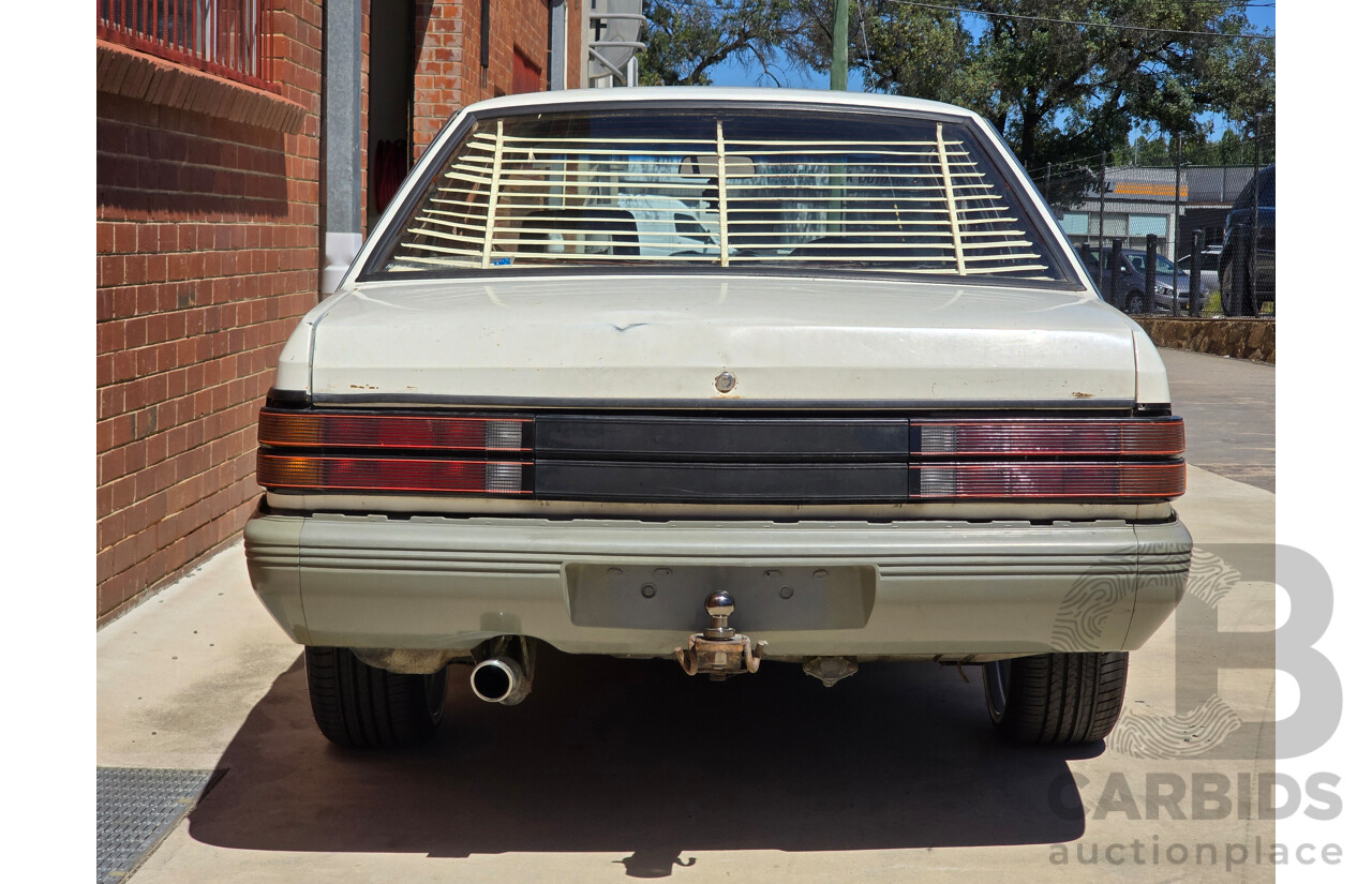 7/1984 Holden VK Commodore SL 4d Sedan Alpine White 3.3L