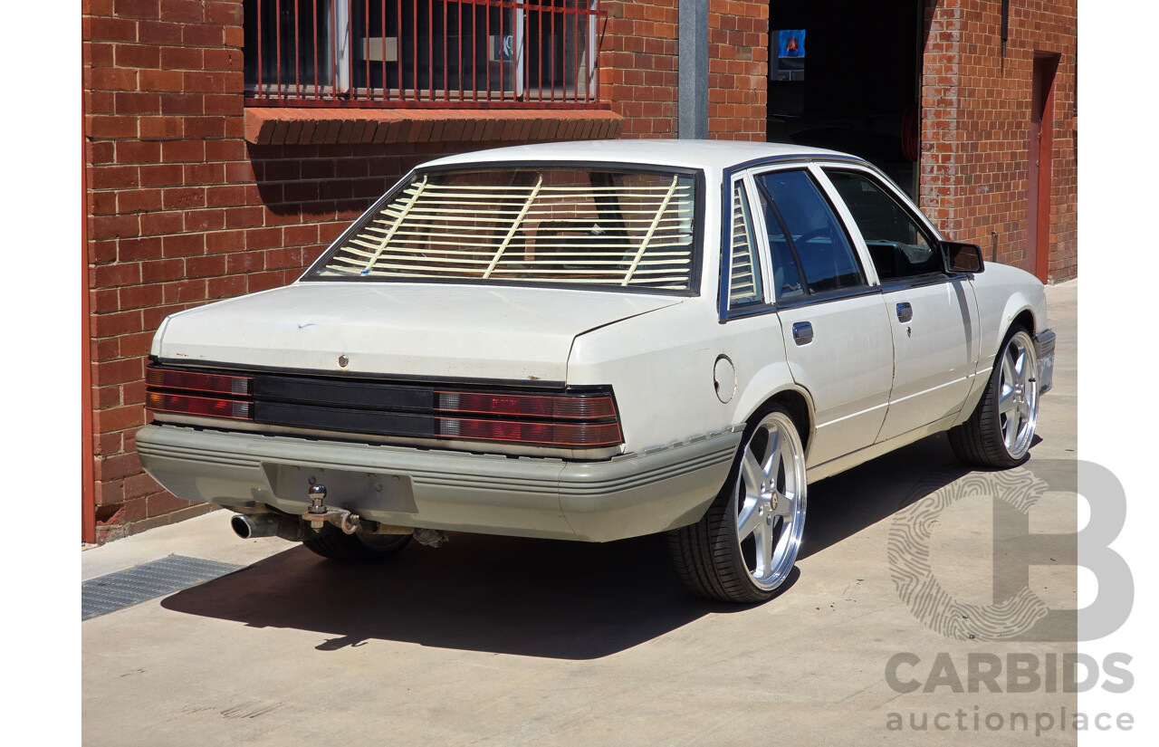 7/1984 Holden VK Commodore SL 4d Sedan Alpine White 3.3L