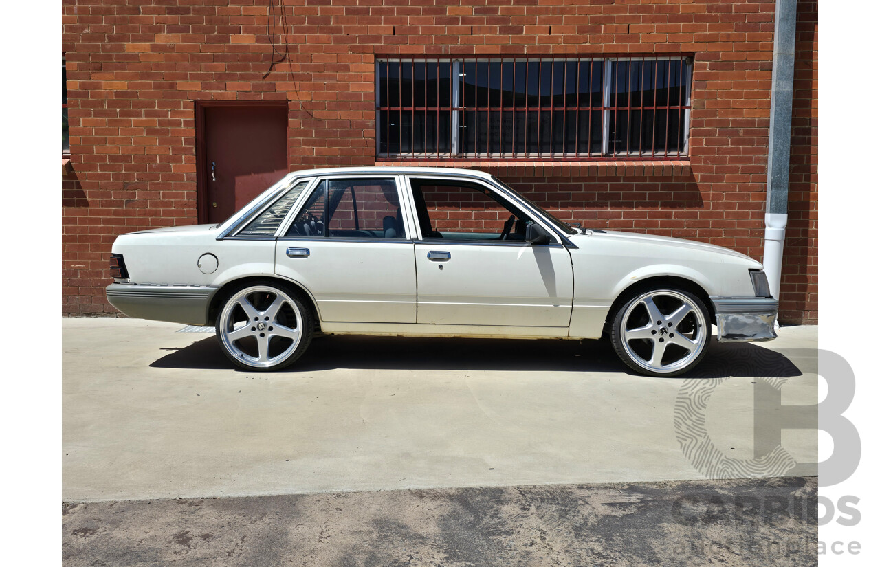 7/1984 Holden VK Commodore SL 4d Sedan Alpine White 3.3L