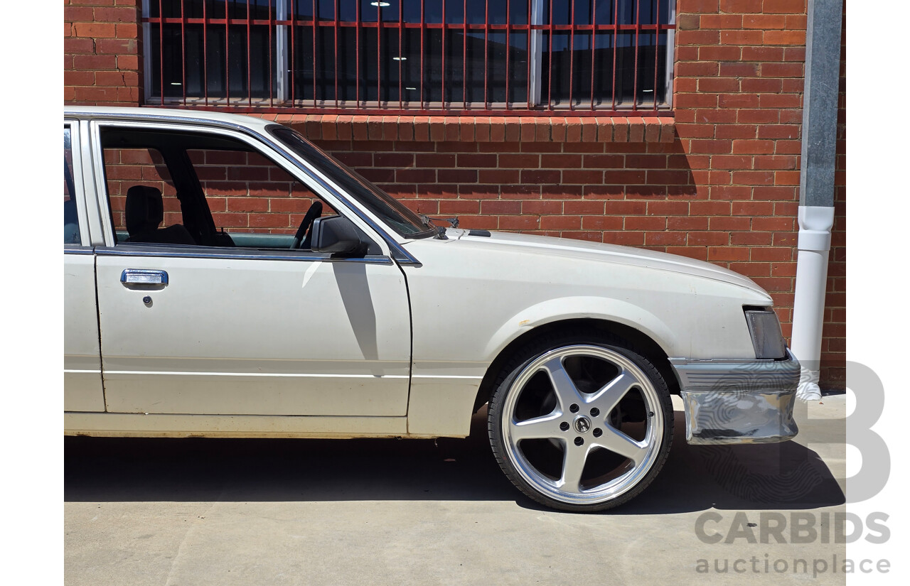 7/1984 Holden VK Commodore SL 4d Sedan Alpine White 3.3L