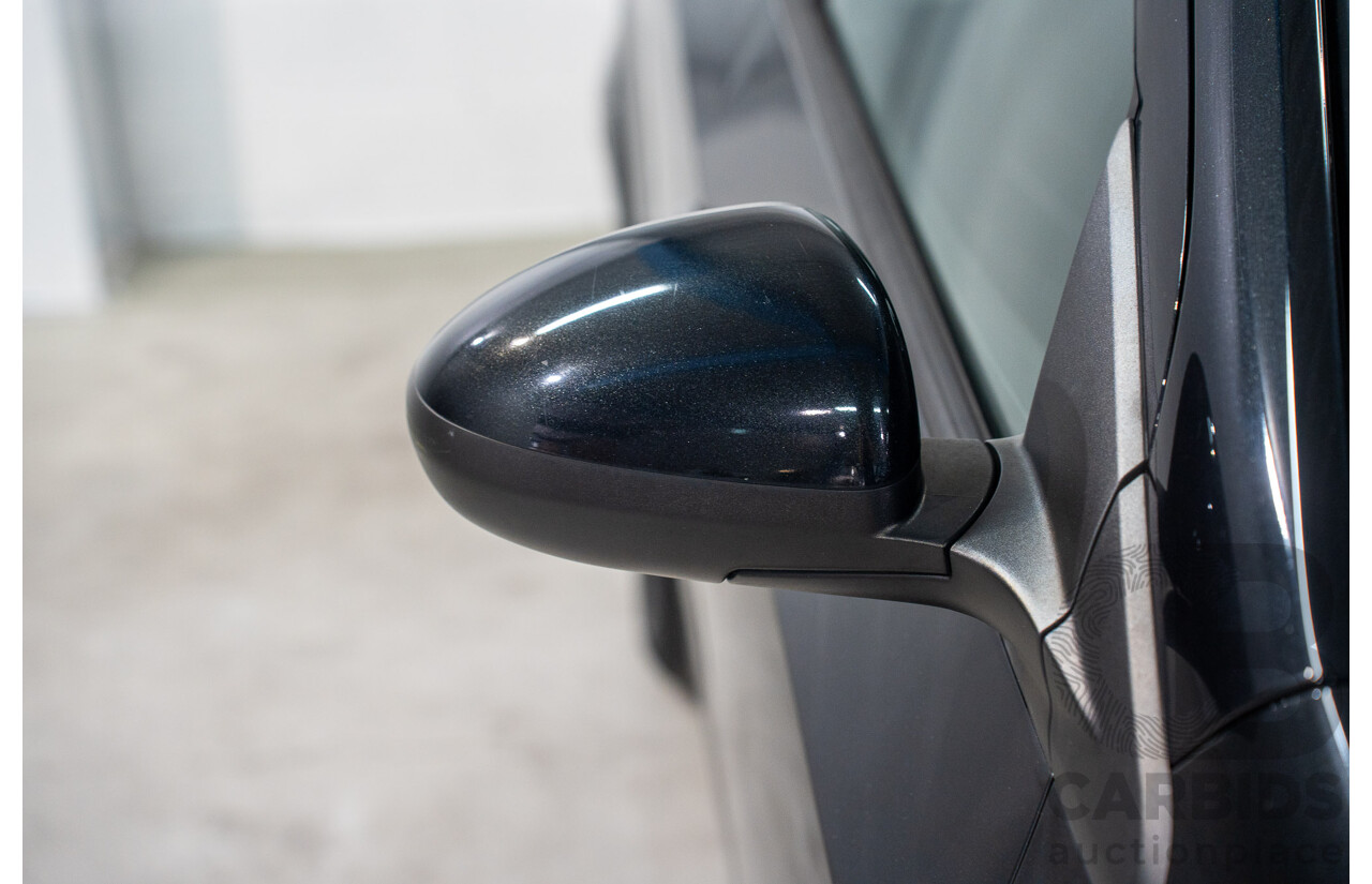 5/2013 Holden Barina CD TM MY13 4d Sedan Carbon Flash Metallic 1.6L