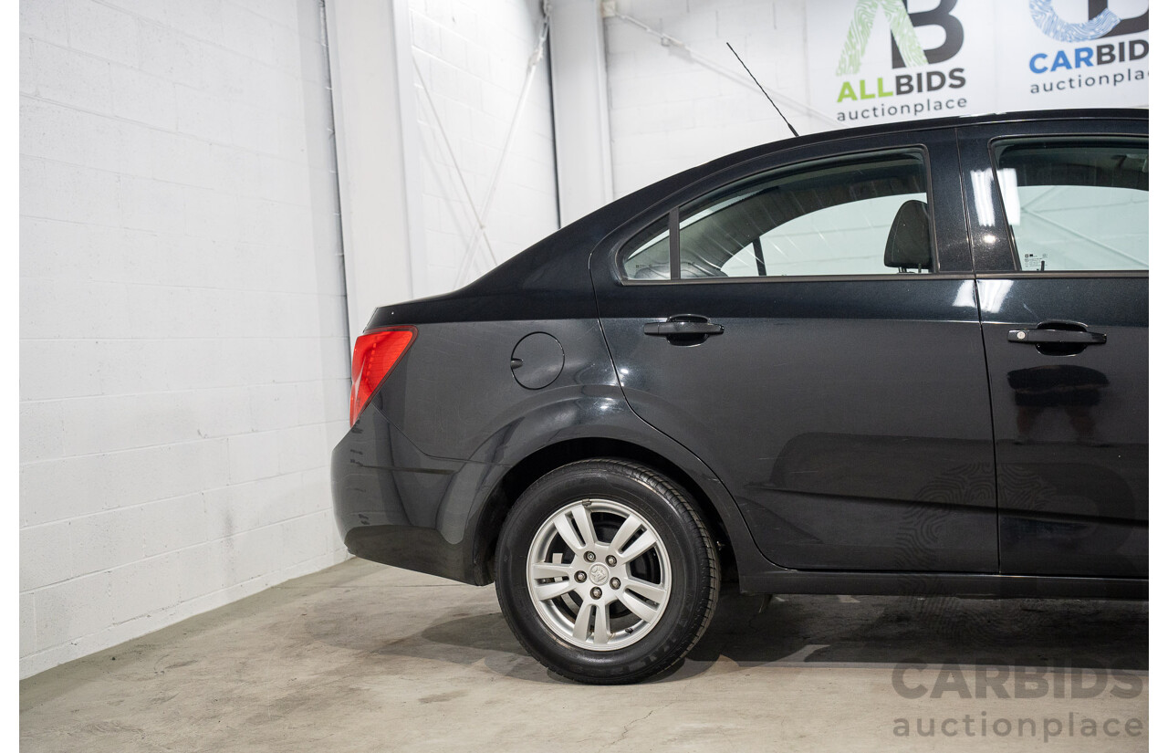 5/2013 Holden Barina CD TM MY13 4d Sedan Carbon Flash Metallic 1.6L