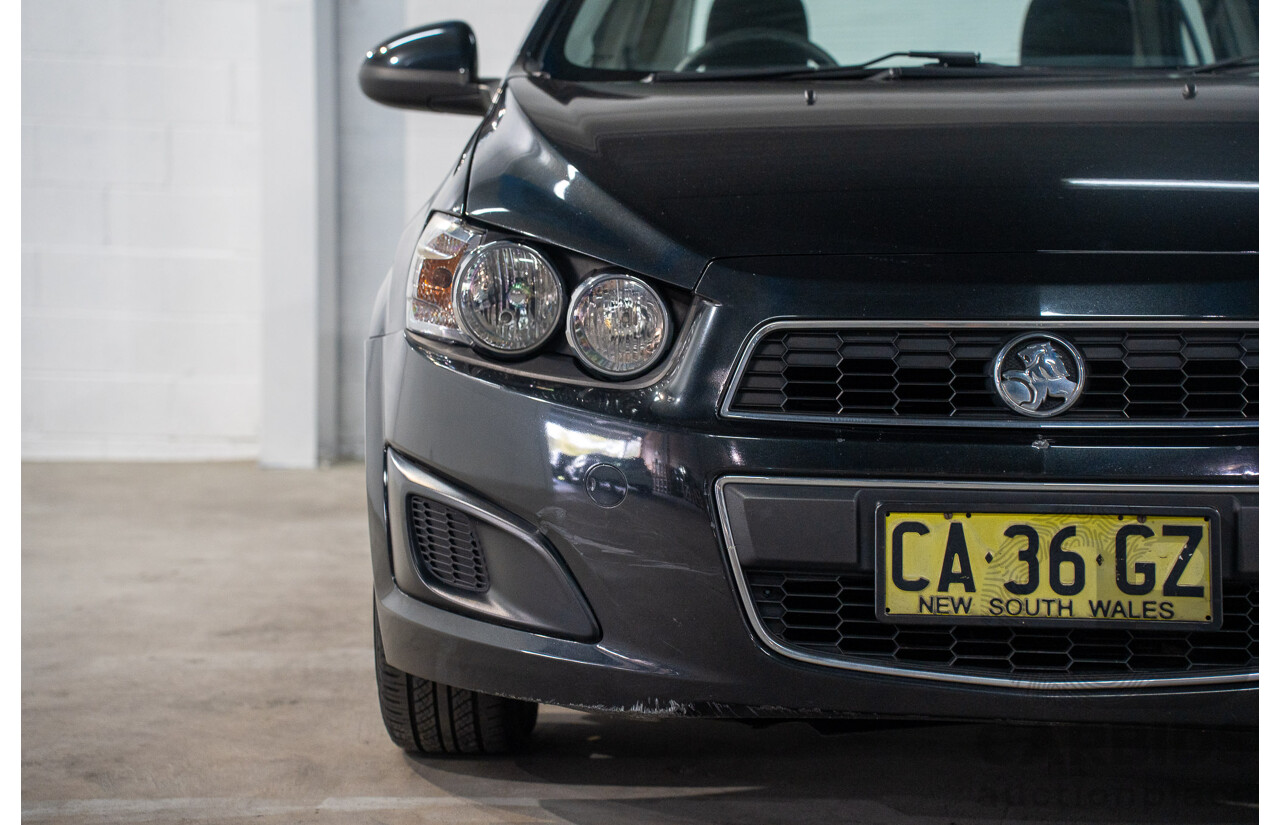 5/2013 Holden Barina CD TM MY13 4d Sedan Carbon Flash Metallic 1.6L