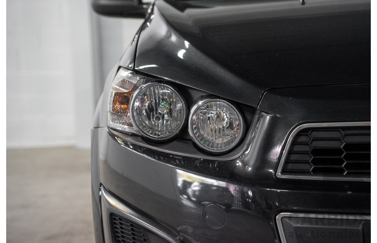 5/2013 Holden Barina CD TM MY13 4d Sedan Carbon Flash Metallic 1.6L