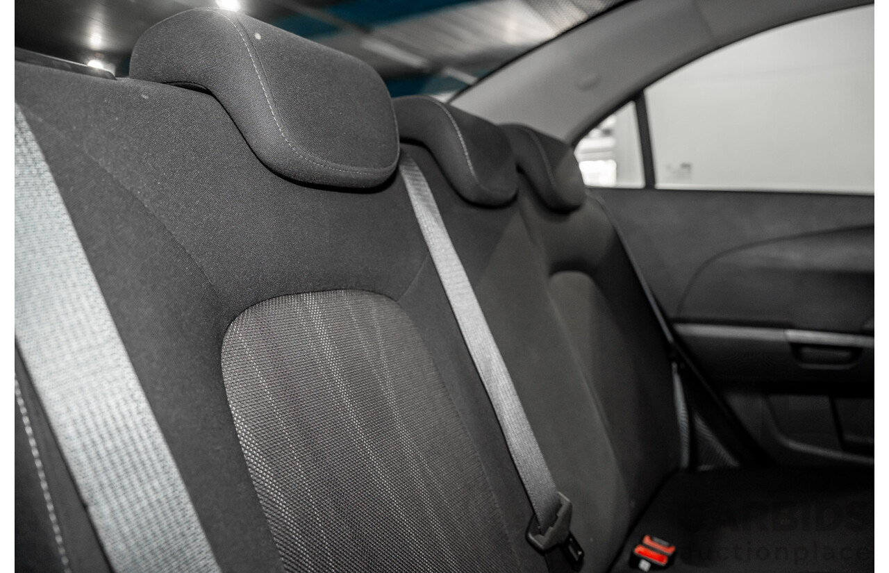 5/2013 Holden Barina CD TM MY13 4d Sedan Carbon Flash Metallic 1.6L