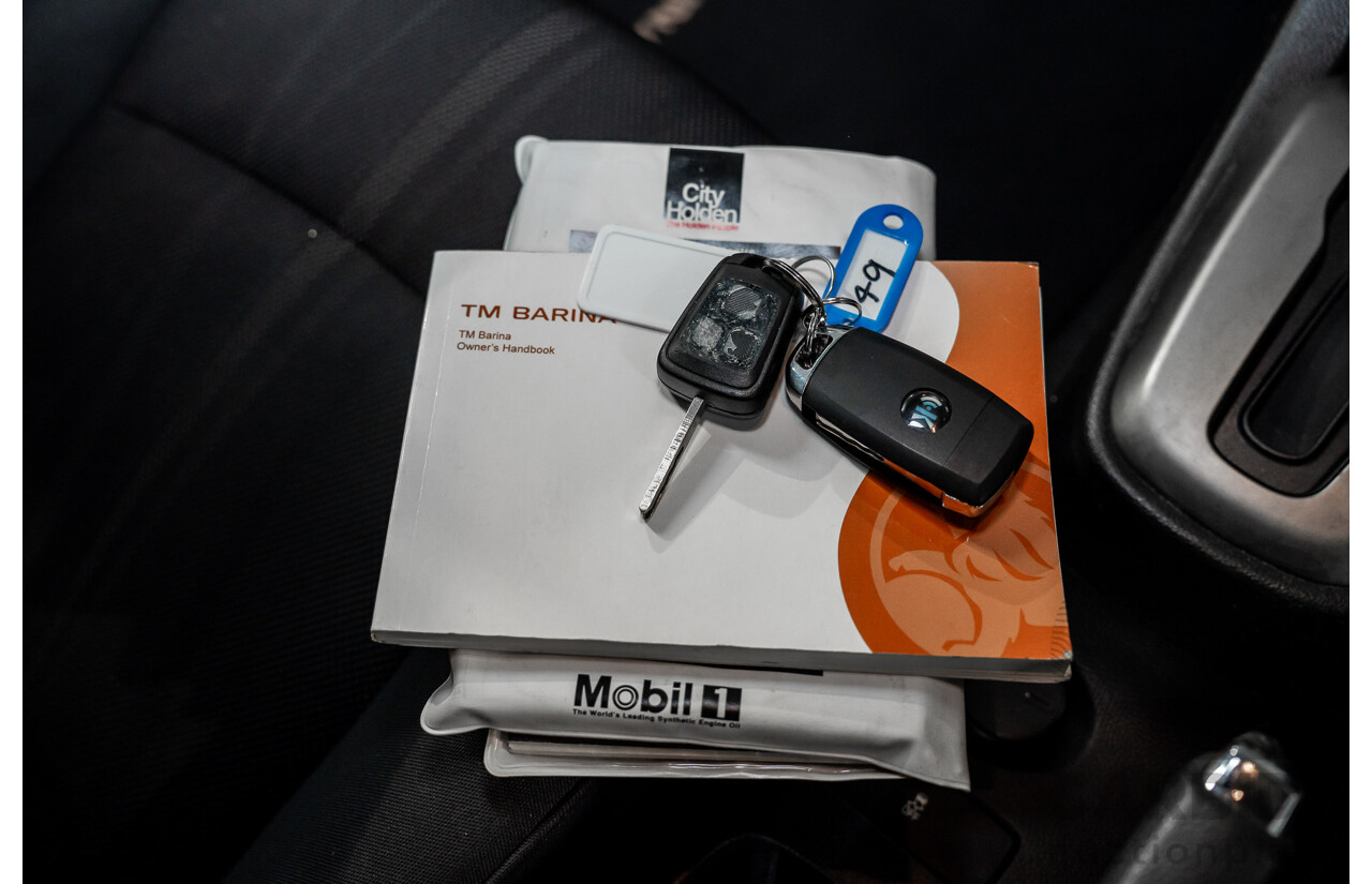 5/2013 Holden Barina CD TM MY13 4d Sedan Carbon Flash Metallic 1.6L