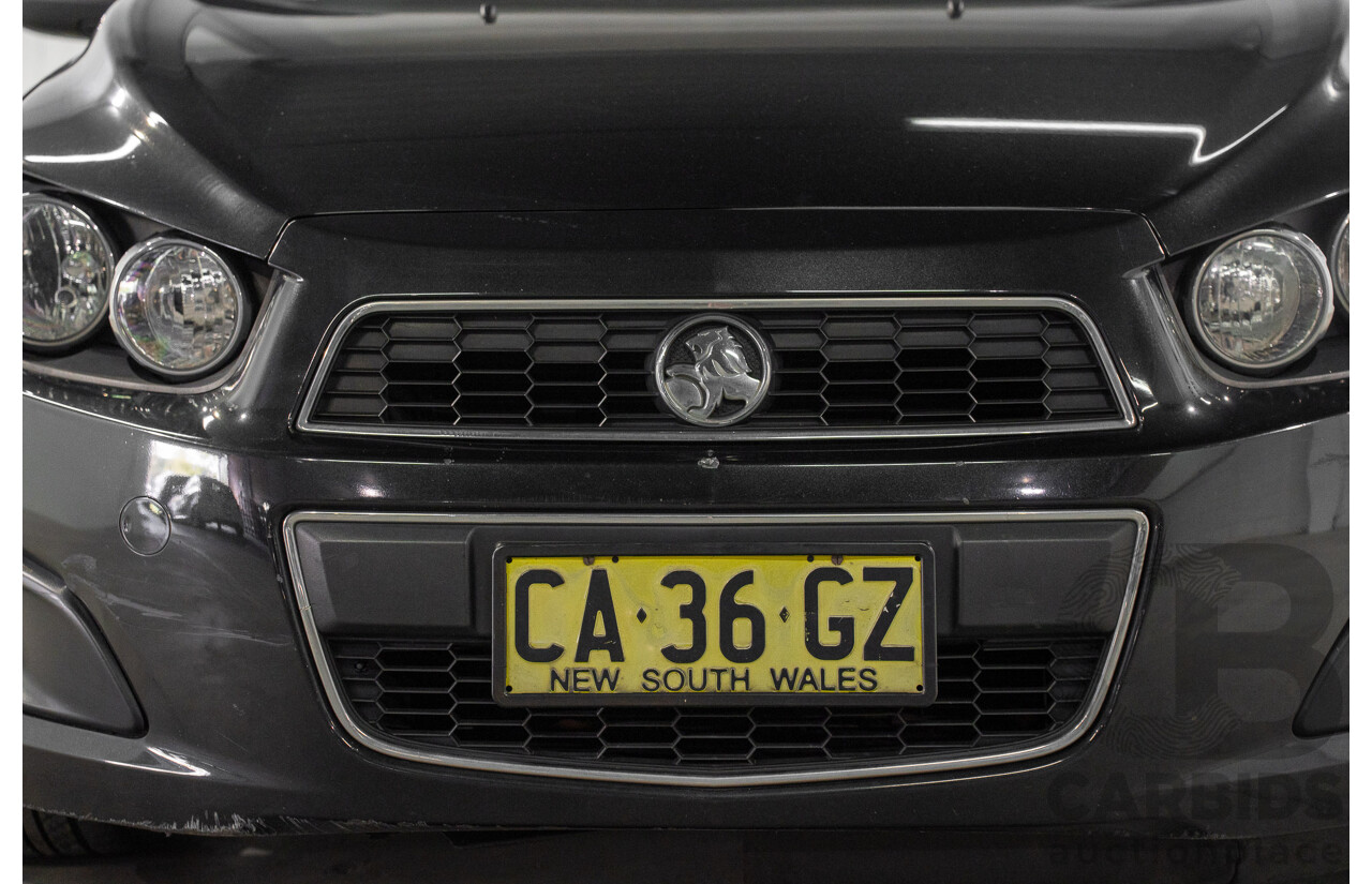 5/2013 Holden Barina CD TM MY13 4d Sedan Carbon Flash Metallic 1.6L