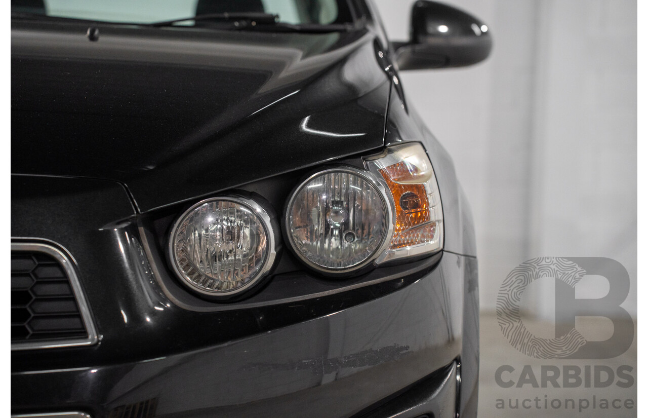 5/2013 Holden Barina CD TM MY13 4d Sedan Carbon Flash Metallic 1.6L