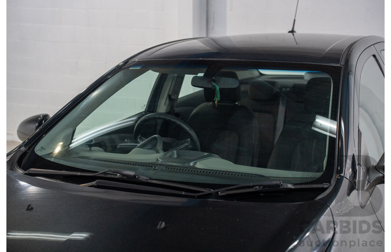 5/2013 Holden Barina CD TM MY13 4d Sedan Carbon Flash Metallic 1.6L