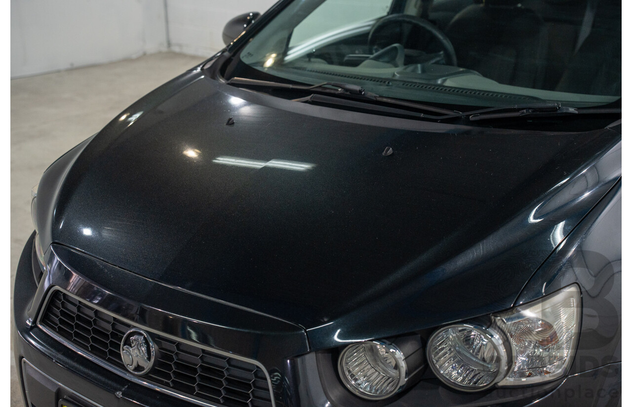 5/2013 Holden Barina CD TM MY13 4d Sedan Carbon Flash Metallic 1.6L