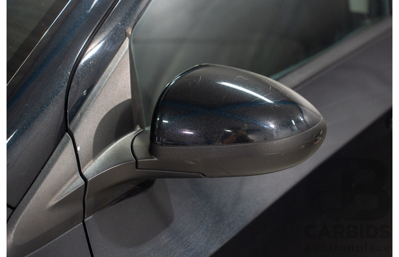 5/2013 Holden Barina CD TM MY13 4d Sedan Carbon Flash Metallic 1.6L