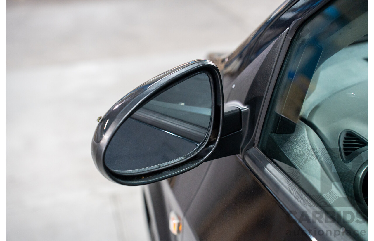 5/2013 Holden Barina CD TM MY13 4d Sedan Carbon Flash Metallic 1.6L