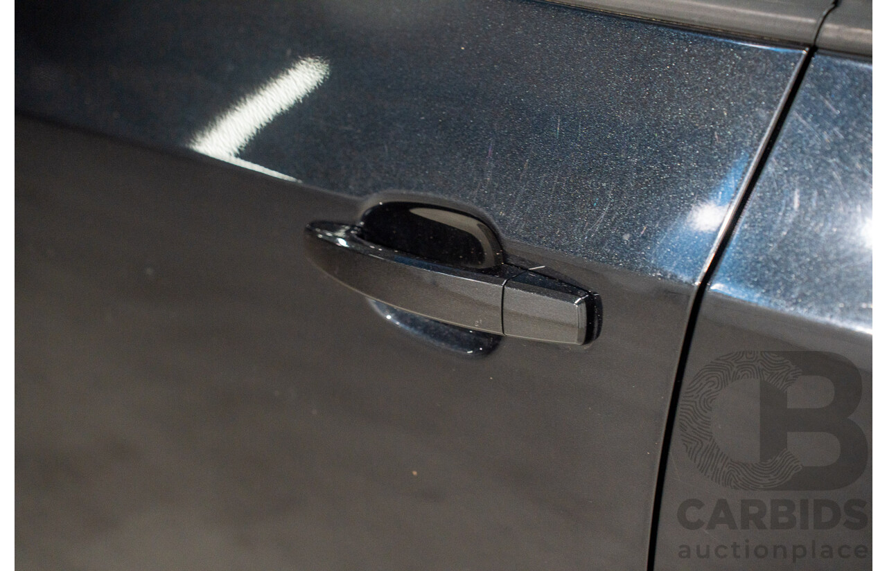 5/2013 Holden Barina CD TM MY13 4d Sedan Carbon Flash Metallic 1.6L