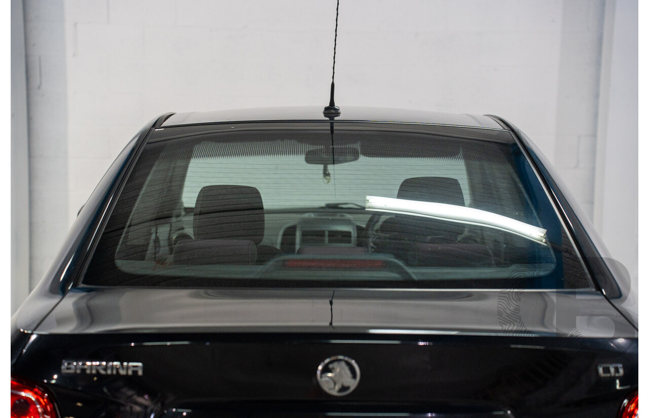 5/2013 Holden Barina CD TM MY13 4d Sedan Carbon Flash Metallic 1.6L