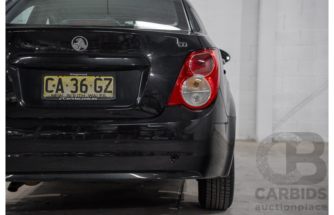 5/2013 Holden Barina CD TM MY13 4d Sedan Carbon Flash Metallic 1.6L