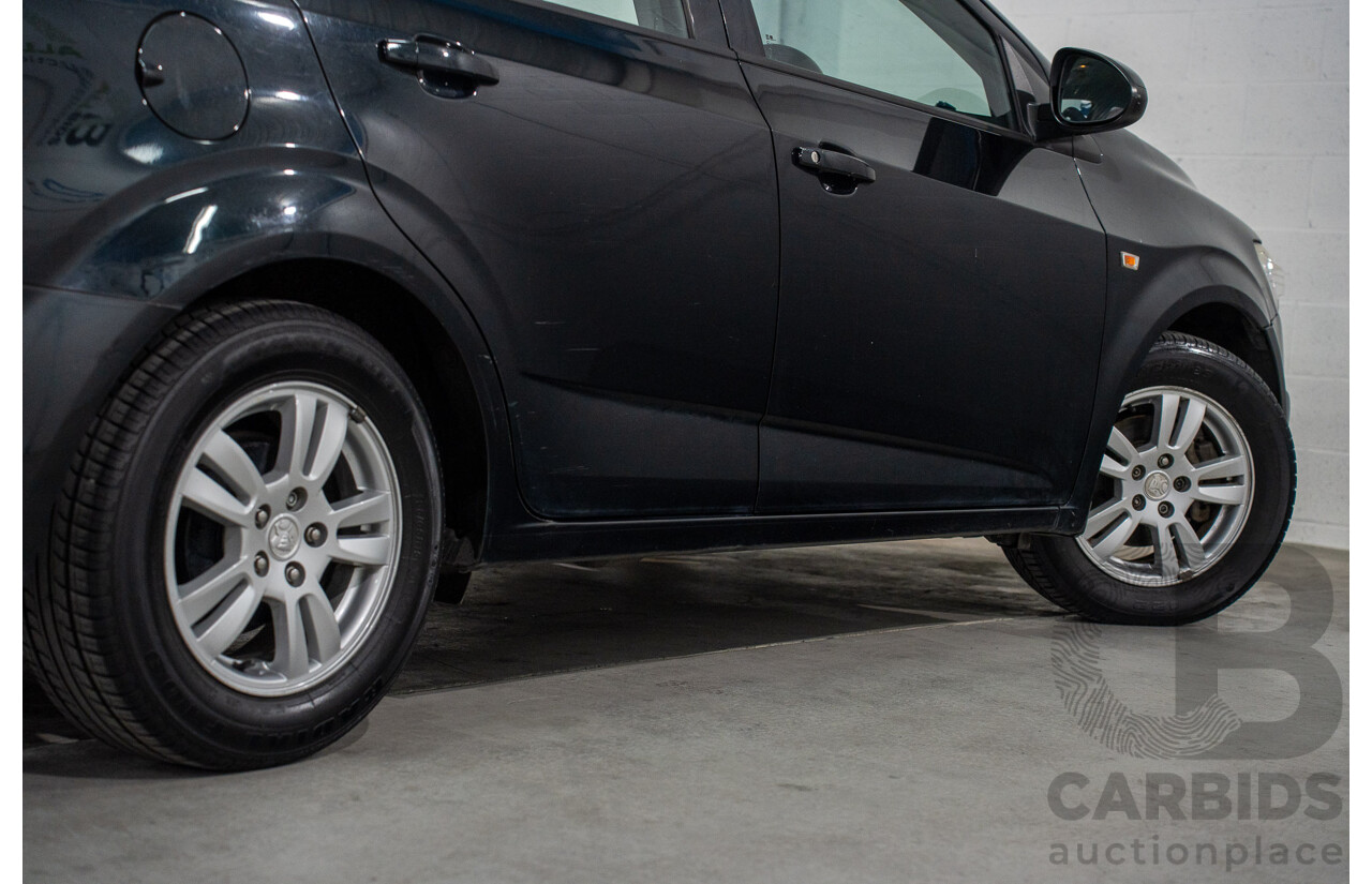 5/2013 Holden Barina CD TM MY13 4d Sedan Carbon Flash Metallic 1.6L