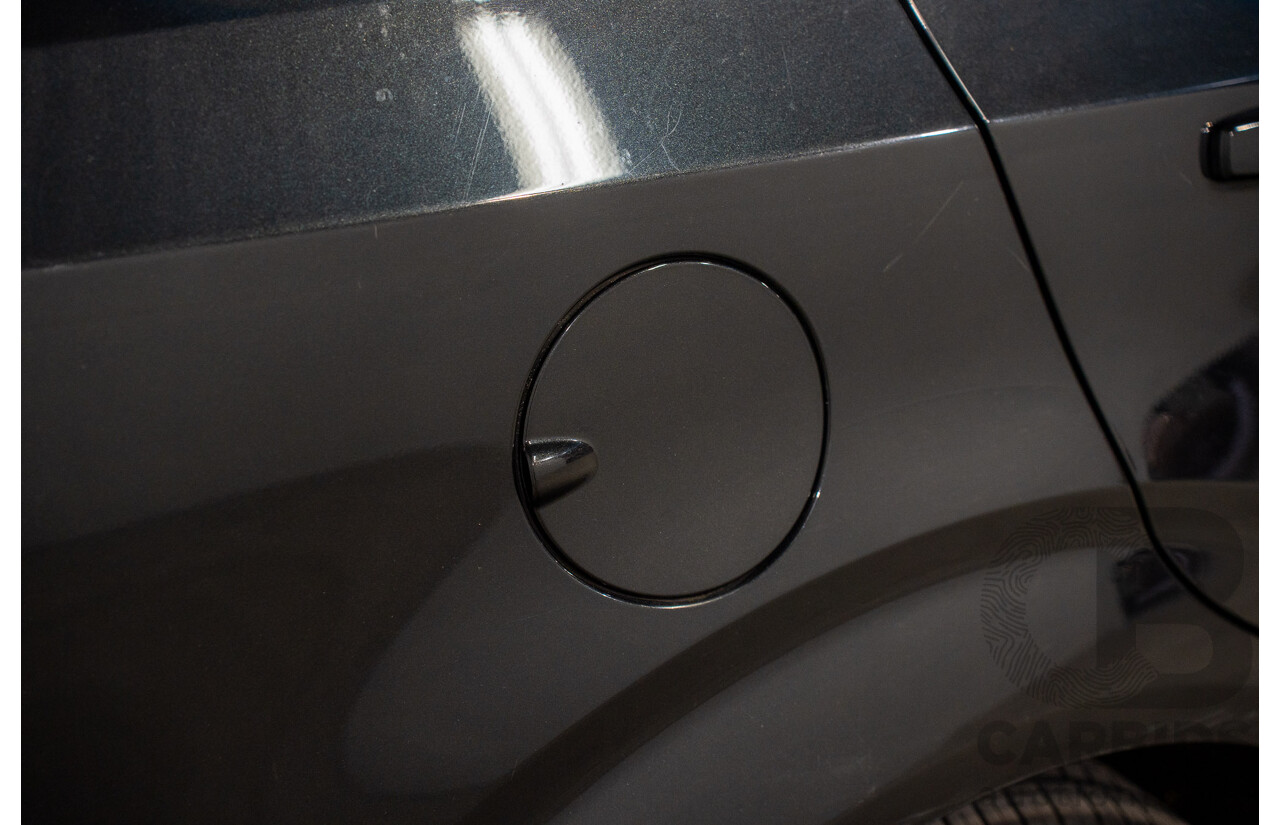 5/2013 Holden Barina CD TM MY13 4d Sedan Carbon Flash Metallic 1.6L