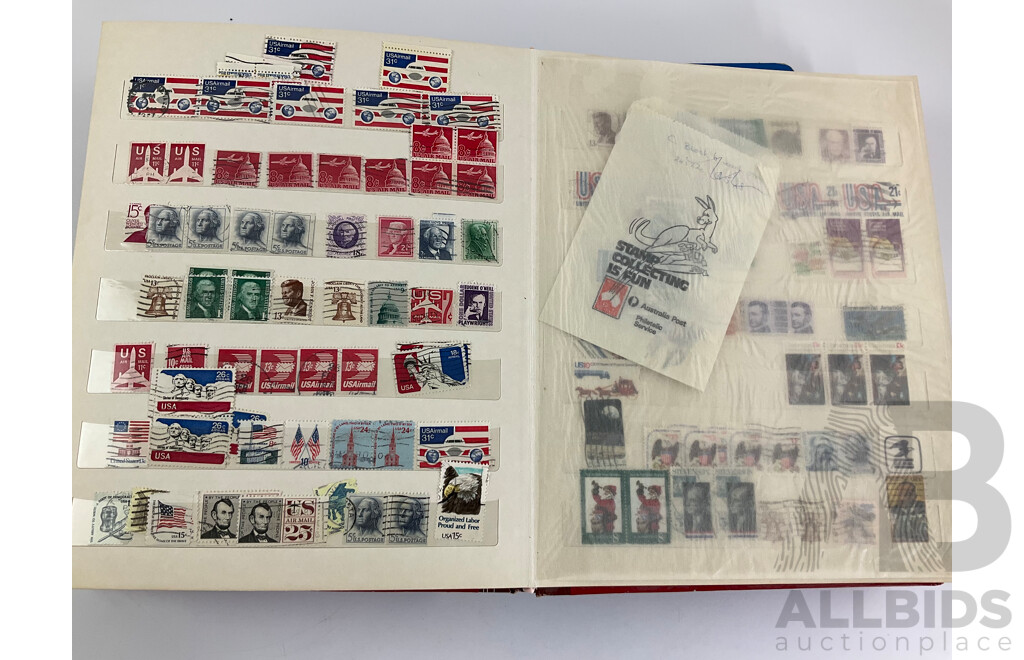 Two Albums of Vintage Stamps Including New Zealand, Dubai, Mongolia, Poland, Cocos Islands, Zimbabwe, Singapore, Canada, Yugoslavia, USA, Netherlands, UK, Fiji, France, PNG, Grenada, Isle of Men