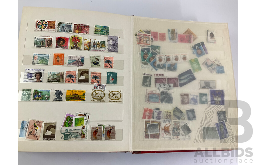 Two Albums of Vintage Stamps Including New Zealand, Dubai, Mongolia, Poland, Cocos Islands, Zimbabwe, Singapore, Canada, Yugoslavia, USA, Netherlands, UK, Fiji, France, PNG, Grenada, Isle of Men