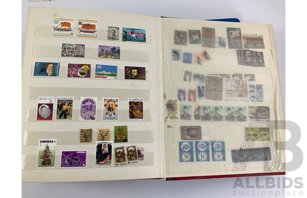 Two Albums of Vintage Stamps Including New Zealand, Dubai, Mongolia, Poland, Cocos Islands, Zimbabwe, Singapore, Canada, Yugoslavia, USA, Netherlands, UK, Fiji, France, PNG, Grenada, Isle of Men